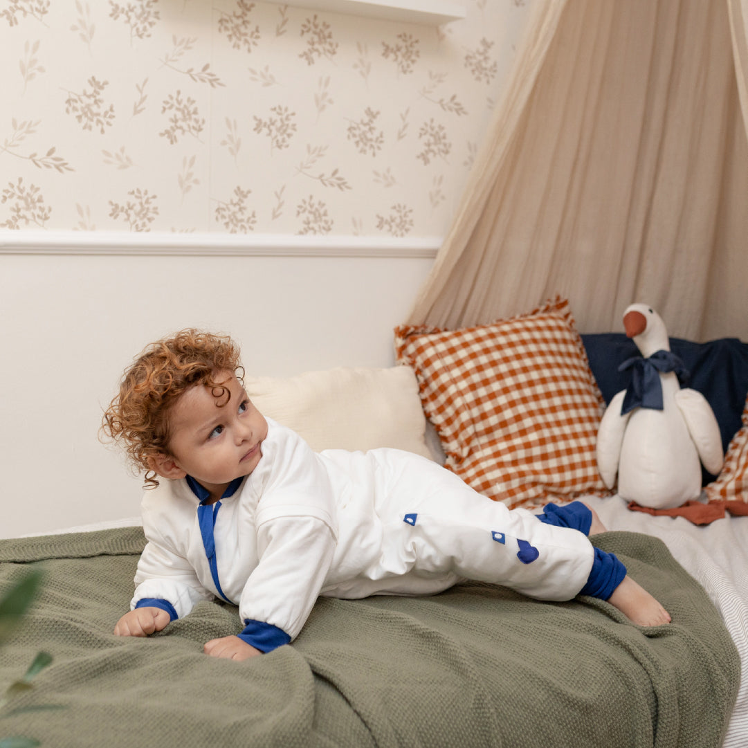 boy gets off the bed by himself