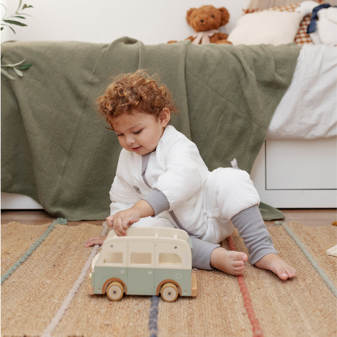 boy playing within vosbos sleep suits