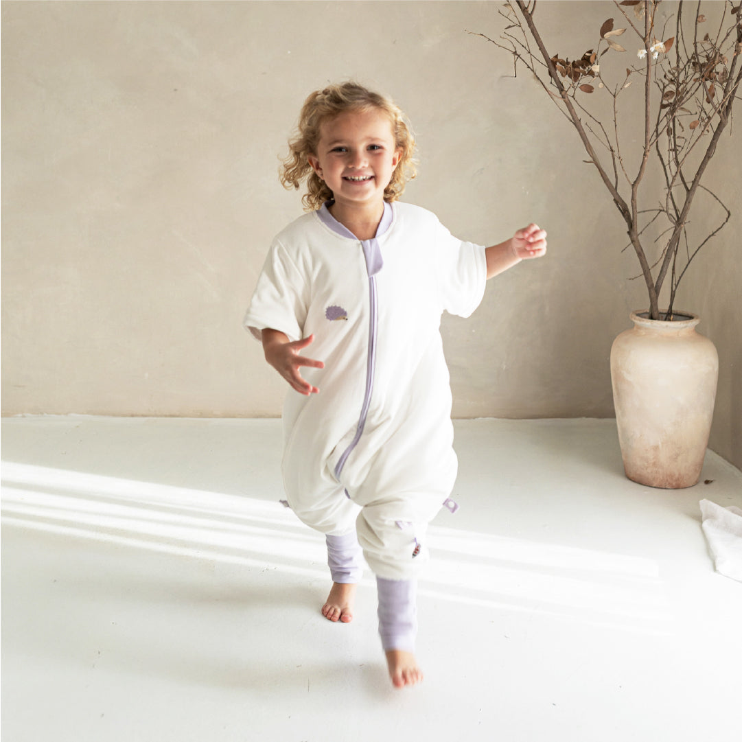 girl running in vosbos sleep suit
